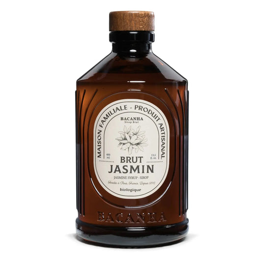 Butelka syropu Bacanha Brut Jasmin – organiczny syrop jaśminowy w brązowym szkle z drewnianym korkiem, widok z przodu.